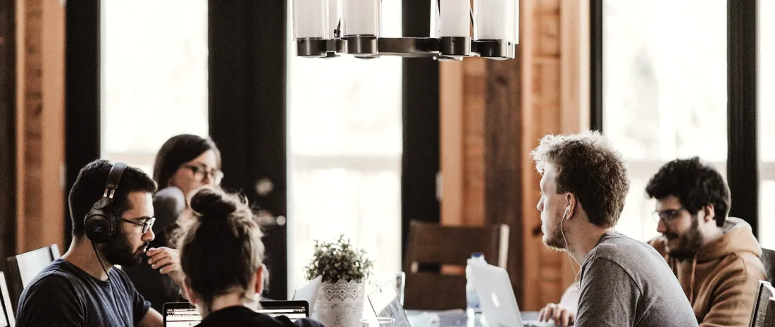 A team meeting around a work table