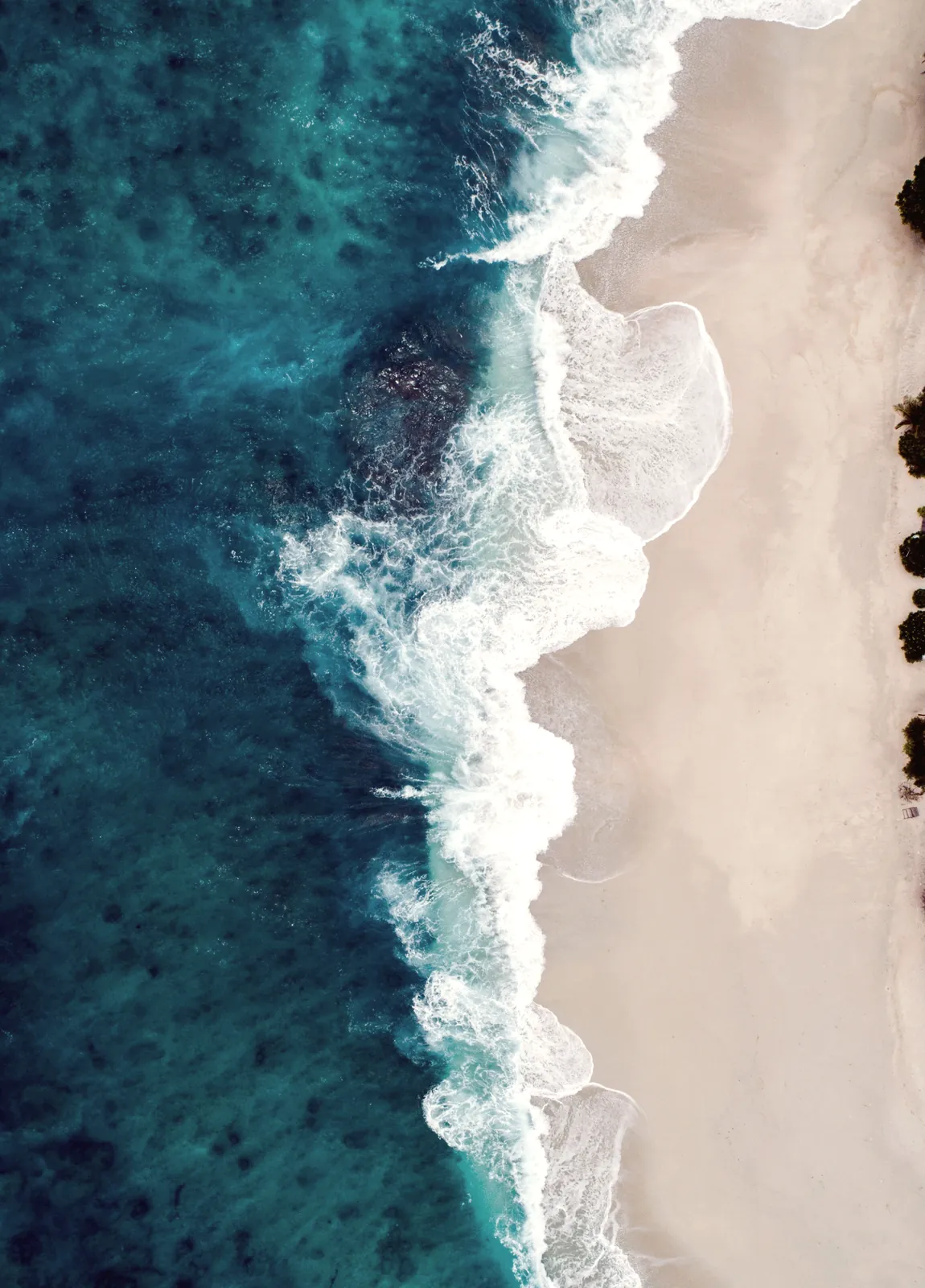The waterline seen from above on soft sand